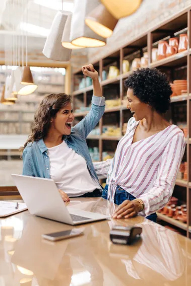 Two business owners celebrating