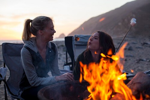 Two-girls-by-camp-fire