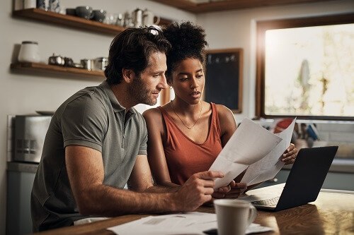 Couple reviewing papers
